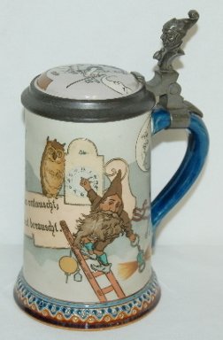 Mettlach #2092 1/2 Liter Etched Stein, Gnome: Mettlach #2092 1/2 Liter Etched Stein: etched with a gnome, the keeper of the clock tower, on a ladder setting a clock; has a verse on it; signed by Schlitt; has an inlaid lid.