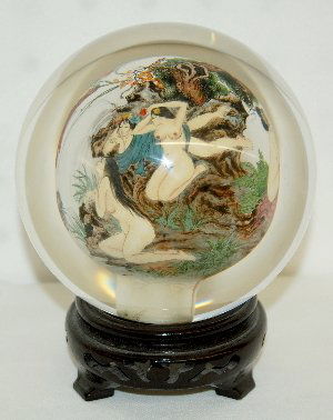 Glass Ball With Multiple Nudes Inside: Glass Ball With Multiple Nudes Inside: Reverse painted in fine detail are 7 nude ladies at a waterfall and stream; rocks, flowers, trees and other shrubbery add to the exotic effect of the scenes. The