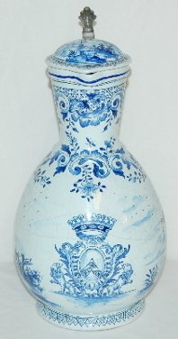 Faience Cobalt Decorated Pitcher, Fishing Scene: Faience # JV 29/5 1.5 Liter Pitcher: Cobalt decorated with a large crest; a fishing and butterfly catching scene; there is a boat harbor scene on the lid. (There is crazing all over.)