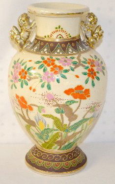 Satsuma Pottery Vase w/ Foo Handles: Satsuma Pottery Vase w/ Foo Handles: the front has many brightly colored enamel flowers on the ground and tree branches. The opposite side has similar but less of the same decoration. (Worn gold on th
