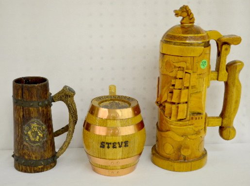 3 Wooden Hand Made Beer Steins: 3 Wooden Hand Made Beer Steins: 1.) Wooden 2 liter relief carved sailboat w/ horse head finial, hand made. 2.) Wood barrel w/ metal straps, from Herzogen Aukach; Germany; front marked "Steve" hand mad