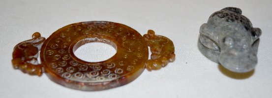 Gray Jade Toad & Soapstone: Gray Jade Toad & Soapstone: 1.) The toad sits and has a coin in its mouth; the back portion is covered in black specks. 1"T x 2 5/8"L 2.) Soapstone ring w/ dragon like figure in 2 places; brown transl