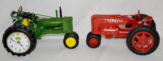 2 Toy Tractors, John Deere & Farmall: 2 Toy Tractors, John Deere & Farmall: 1.) The John Deere was made by the Danbury Mint in China; 8 1/2" L. 2.) The Farmall is made of hard plastic and has no maker's information; 8" L.