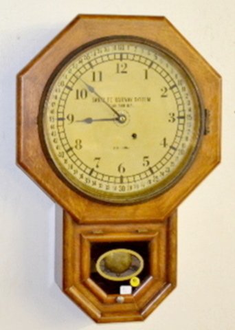 Seth Thomas 12" Drop Octagon Clock: Seth Thomas 12" Drop Octagon Clock: T.O.; in an old oak case with a Santé Fe Railway System dial with pendulum; has an inside label. Not tested. 24" T.