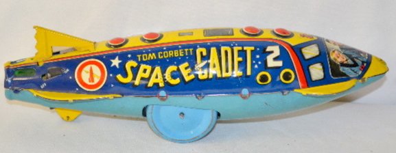 Marx Tom Corbett Space Cadet Robot Toy: Marx Tom Corbett Space Cadet Robot Toy: Tin litho with key wind and on/off switch; labeled; nicely colored and original; working. (There are some light scratches.) 4" x 12" L.