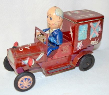 Tin Litho Battery Operated "Crazy" Car Toy: Tin Litho Battery Operated "Crazy" Car Toy: There is a driver in the car with labels "Arabama" "For Texas" "Western" and others on it; tin litho hub caps on the front but not the back. (The battery bo