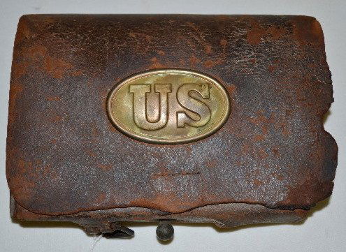 Civil War Era Leather U.S. Ammo Pouch: Civil War Era Leather U.S. Ammo Pouch: Has an oval brass U.S. on the front; flips up to reveal tin containers inside and a smaller flat pouch under the straps; has straps for mounting on a belt or pos