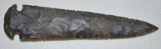 Native American Spear Point, Dovetail: Native American Spear Point, Dovetail: Made from a black material and is very uniform in shape except for one of the tips on the rounded base is a slight bit shorter than the other. 5 1/16" L. **Pleas