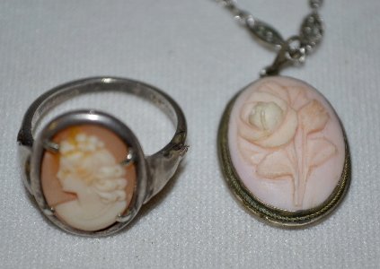 Old Shell Cameo Ring & Pendant on Chain: Old Shell Cameo Ring & Pendant on Chain: 1.) The ring has a Grecian lady with a fancy hairdo with a flower on top is facing left; made by the Cameo Co.; size 7; .800 silver. 2.) The pendant's shell is