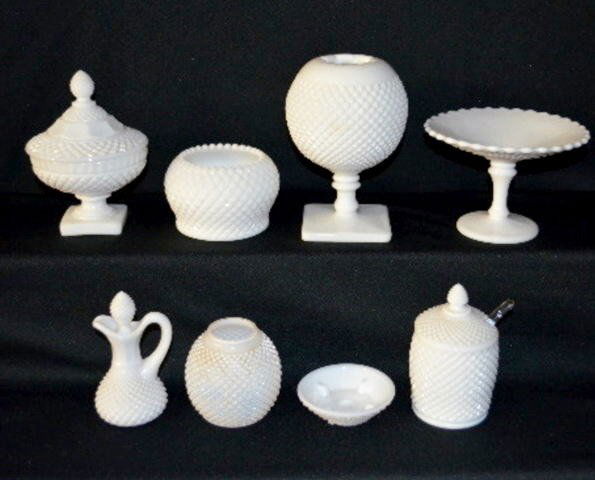 7 Pieces of Diamond Point Milk Glass: 7 Pieces of Diamond Point Milk Glass: There is a stemmed rose bowl, a fairy lamp, a candy jar, an open compote, a honey jar with the lid and spoon, an open bowl and a small size cruet. No condition pr