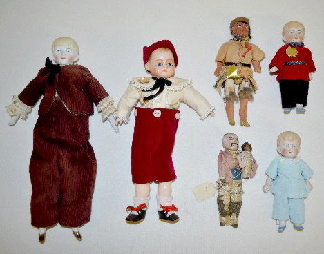 6 Boy Dolls, 3 Bisque and 3 Others: 6 Boy Dolls, 3 Bisque and 3 Others: The 3 bisque dolls have Intaglio painted eyes; there is also 1 composition doll with paperweight eyes, a Native American and an Asian doll. Tallest 8". Sells as is.