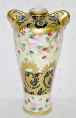 Hand Painted Nippon Floral Vase: Hand Painted Nippon Floral Vase: This double handles vase is light yellow with pink blossoms and red buds with a band of dark green with gold decoration; marked on the bottom. (There is some wear to t