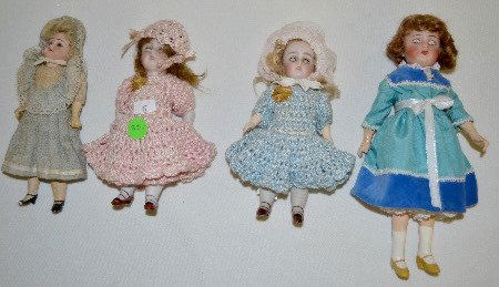 4 Antique Dolls, Bisque and Paper Mache: 4 Antique Dolls, Bisque and Paper Mache: 1.) 2 are all bisque and jointed at the hips and shoulders with sleep eyes. 2.) A bisque head 2/0 on a paper mache body with set eyes and is jointed at the sho