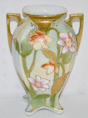 Hand Painted Nippon Floral Vase: Hand Painted Nippon Floral Vase: This double handled, splat footed vase is light green with orange and pink lily like flowers with green stems and gold leaves. 7 1/2" T.