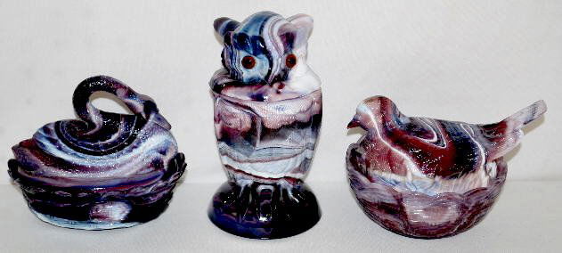 3 Pieces Purple Slag Glass, Imperial & Unmarked: 3 Pieces Purple Slag Glass, Imperial & Unmarked: 1.) Imperial glass Owl covered jar, molded, glass eyes, marked; 6 1/2". 2.) Nesting swan covered dish; unmarked; 4" x 5 1/2". 3.) Nesting bird covered