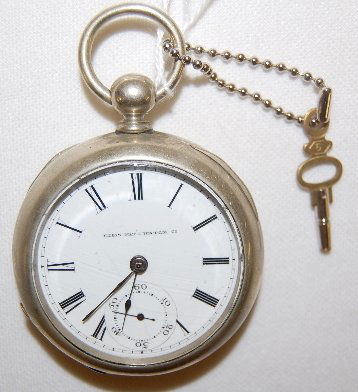 Elgin 7J 18S OF KW/KS Full Pocket Watch: Elgin 7J 18S OF KW/KS Full Pocket Watch: Serial No. 1138034 with a flat dial; in a white Keystone silveroid case No. 1573?48. (The watch was not tested because the key with it did not fit properly. Th