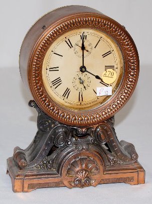 Seth Thomas Copper Clad Key Wind Alarm Clock: Seth Thomas Copper Clad Key Wind Alarm Clock: signed paper dial with seconds sweep hand and 12 hour bit; ornate copper clad case. Not running. 9" T Wound tight.