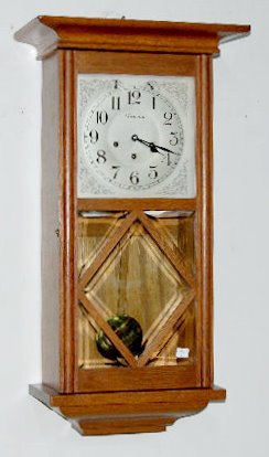 Ansonia Hanging Westminster Chime Clock: Ansonia Hanging Westminster Chime Clock: 8 day, T & S, Westminster rod chime, with square silvered metal dial, oak case, lower beveled door, has pendulum and key, nice finish. Not tested. 28" x 15"
