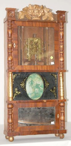 R & JB Terry Triple Decker 2 Wt. Shelf Clock: R & JB Terry Triple Decker 2 Wt. Shelf Clock: T & S brass works; in a mahogany veneered case with stenciled and painted glass, mirror and picture, 1/2 columns, turned spindles, ball feet and a carved 
