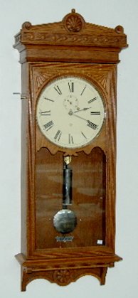 Seth Thomas #30 Weight Oak Wall Clock: Seth Thomas #30 Weight Oak Wall Clock: oak case; nickel trim, pendulum and weight; seconds bit; great oak carved case; super example. Not tested. 48" Long x 18 3/4" Wide; 12" dial. **Please note, this