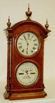 Southern Calendar Clock Co. "Fashion No. 2" Clock: Southern Calendar Clock Co. "Fashion No. 2" Clock: 8 day T & S; double metal dials in a walnut veneer case; with short pendulum and key. Not tested. 31" Long (There is some loss to the walnut veneer.)