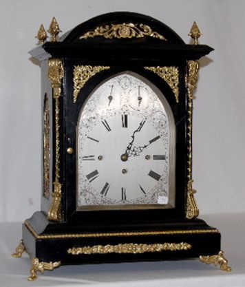 English Double Fusee 8 Bell Bracket Clock: English Double Fusee 8 Bell Bracket Clock: fusee 3 train Cambridge Chimes; ornate brass trim; ebony cabinet; engraved silvered dial; heavy brass pendulum. Runs and strikes. (The door has been glued an