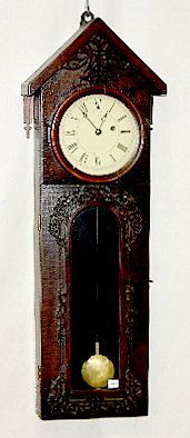 Weight Driven Carved Case Wall Clock: Weight Driven Carved Case Wall Clock: TO with a painted metal dial; has a carved top and door surround; with the pendulum. Not tested. 34" Long (There is no key; there is some case damage on the botto