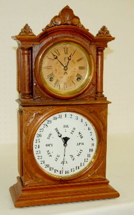 Ingraham BB Lewis Calendar Clock: Ingraham BB Lewis Calendar Clock: double dial shelf model carved walnut case; stained upper dial; great inside label. (Minor separations in wood dial surrounds.) 22"