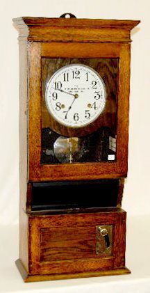 Cincinnati Time Recorder Manual Time Clock: Cincinnati Time Recorder Manual Time Clock: metal painted dial, wall mount oak case, has pendulum and key. 35" x 16"