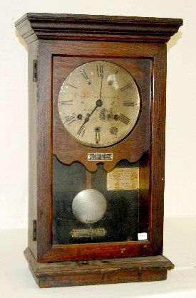 Simplex Time Recorder Wall Clock: Simplex Time Recorder Wall Clock: T & S; with a painted metal dial; in an oak case; with the pendulum and key. Not tested. 25 1/4" Tall x 15" Wide (This clock is not complete.) **Please note, this ite