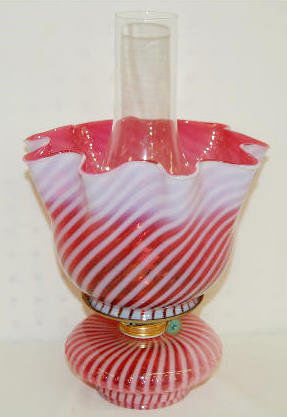 Fenton Cranberry Opal. Spiral Optic Kero Lamp: Fenton Cranberry Opal. Spiral Optic Kerosene Lamp: With matching base and shade; from the early 1900's; not marked. 14" Tall (to the top of the chimney) No condition problems.