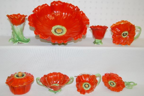 8 Pcs Royal Bayreuth Orange Poppy Tableware: 8 Pcs Royal Bayreuth Orange Poppy Tableware: There is an open bowl; a cream pitcher; mustard pot with the ladle; tea strainer; nut bowl; hatpin holder; covered box and a double handled bowl. Largest 8