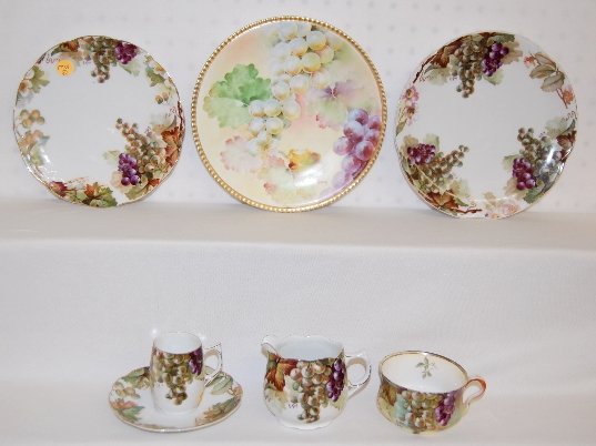 6 Pieces Grape Decorated China, A. Koch & Others: 6 Pieces Grape Decorated China, A. Koch & Others: 5 JC Senta or Louise Bavaria, artist signed - A. Koch items, including 2 plates, a demi cup and saucer, a cup and creamer; there is also a hand painte