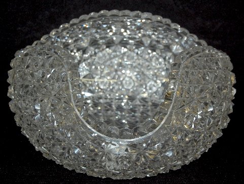 Brilliant Period Cut Glass Center Bowl: Brilliant Period Cut Glass Center Bowl: It is pulled up at 3 sides and cut with rayed buttons in varying sizes. 5 1/2" Tall x 9 1/2" Diameter (There are as expected minor rim flakes.)