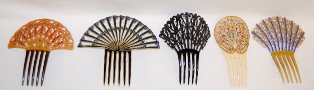 5 Vintage Haircombs, Plastic with Rhinestones: 5 Vintage Haircombs, Plastic with Rhinestones: 1.) 2 color plastic with red rhinestones accents on a floral and scroll design; 6" x 5 3/4". 2.) 2 color, black on yellow, with blue rhinestones accentin
