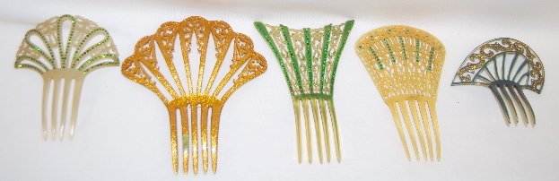 5 Vintage Haircombs, Plastic with Rhinestones: 5 Vintage Haircombs, Plastic with Rhinestones: 1.) Very pale olive green color with loops that have green rhinestone accents; 5 3/4" x 4 3/4 Wide. 2.) Large goldstone with fancy open work and amber rh