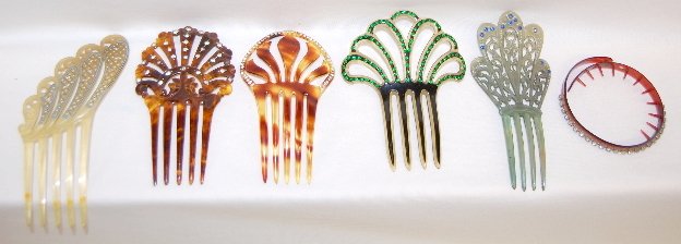 6 Vintage Plastic Haircombs: 6 Vintage Plastic Haircombs: 1.) Pale yellow with painted blue and black designs on shapes in graduated sizes with clear rhinestone accents; 6 1/4" x 3" Wide. (Three stones are missing.) 2.) Dark tort
