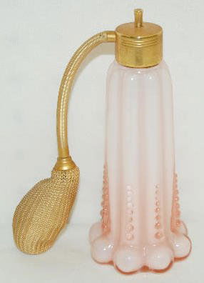 Fenton Rose Overlay Perfume Bottle, DeVilbiss: Fenton Rose Overlay Perfume Bottle, DeVilbiss: Has eight ribs with eight graduated beads on each rib; with atomizer. The owner's note states it is DeVilbiss. Not marked. 6 1/8" Tall (The atomizer is b