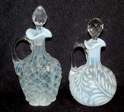 2 Fenton French Opalescent Cruets w/Stoppers: 2 Fenton French Opalescent Cruets w/Stoppers: 1.) Swirled Fern with a clear, applied handle and a faceted stopper. (The stopper has a flash chip.) 2.) Lattice with a molded leaf pattern and a clear, p