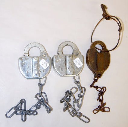 3 Railroad Padlocks, C&NW & CM ST.P. & PRR: 3 Railroad Padlocks, C&NW & CM ST.P. & PRR: 1.) Antique C.M. St. P. & P.R.R. heart shaped with the key. 2.) Two Adlake C&NW purse shaped without the keys. Longest 4" There are no condition problems.