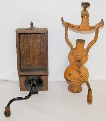 Wall and Table Top Coffee Grinders: Wall and Table Top Coffee Grinders: 1.) Cast iron clamp-on table model marked No. 7. (There is some paint loss; there is no grounds catcher.) 2.) Cast Iron grinder marked "Atwood", attached to a glass