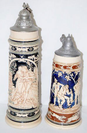 2 German Pottery Steins, 1 & 1 1/2 Liter: 2 German Pottery Steins, 1 1/2 & 1 Liter: 1.) 1 1/2 Liter by Simon Peter Gerz, No. 888 (?); shows a relief molded scene of a courting couple in black and tan colors with panels of the parents on the s