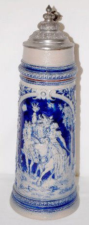 German Stoneware 2 Liter Stein, Horseback: German Stoneware 2 Liter Stein, Horseback: Marked Germany and Simon Peter Gerz #564; relief molded scenes of a kissing couple on horseback flanked by a couple holding birds; blue and grey in color; ha