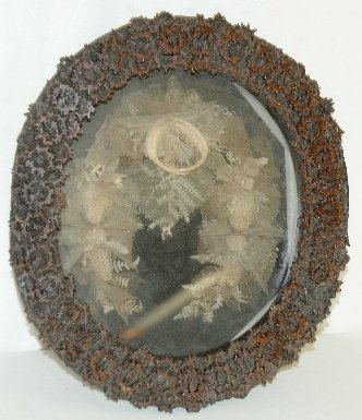 Walnut Frame Shadow Box with Hair Wreath: Walnut Frame Shadow Box with Hair Wreath: The frame is made of sliced walnut shells; the interior is a hair and gossamer wreath. 11" x 12 1/2" There are no condition problems.