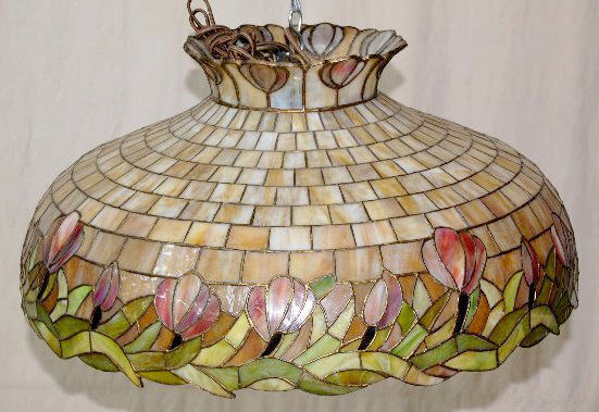 Antique Leaded Glass Hanging Lamp w/Tulips: Antique Leaded Glass Hanging Lamp w/Tulips: Made with slag glass from the top to the flowers in graduated triangular pieces; there are tulips around the crown; the inside has the original 6 light fixt