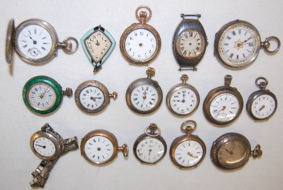 16 Small Silver Watches and Cases, Swiss +: 16 Small Silver Watches and Cases, Swiss +: a mixture of .800, .900 and .935 grades of silver; mostly Swiss made; looks like size 10 and smaller. Not tested. All sells as is, where is.