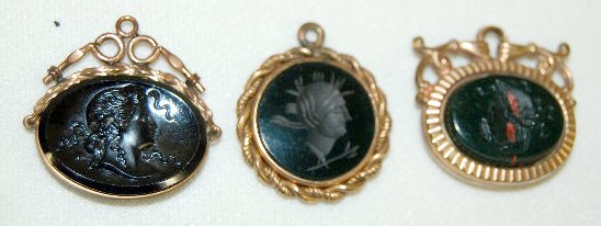 3 Victorian Watch Chain Charms, Intaglio & Relief: 3 Victorian Watch Chain Charms, Intaglio & Relief: 2 are intaglio and 1 is in relief; the round intaglio looks black but is dark green in bright light; the oval with the relief is dark red in bright l