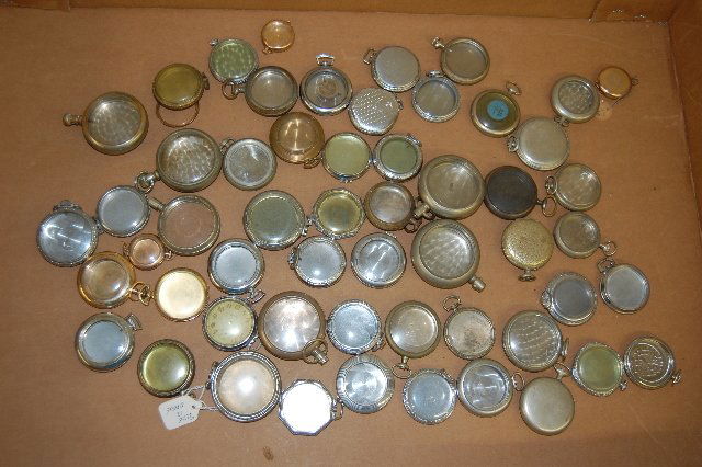 Approximately 50 Metal Pocket Watch Cases: Approximately 50 Metal Pocket Watch Cases, No Movements: There is no silver; most have crystals; all are used. Complete or not, all sell as is where is.