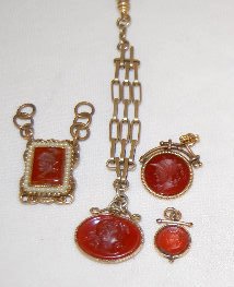 4 Vintage Carnelian Watch Chain Charms: 4 Vintage Carnelian Watch Chain Charms: three intaglio and 1 in relief. All sell as is, where is.