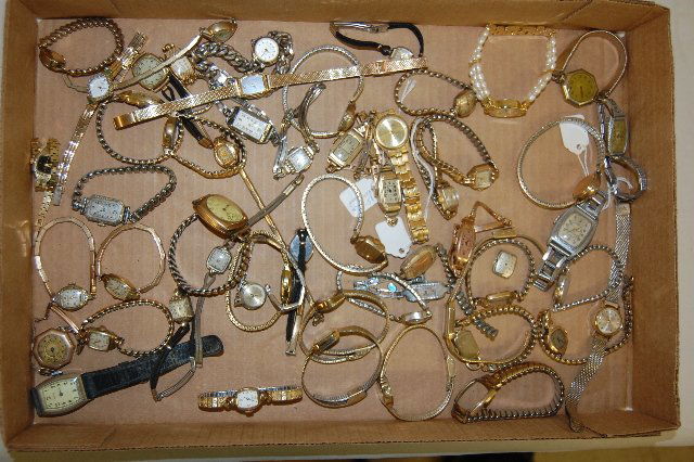 50 Women's Wrist Watches: 50 Men's & Women's Wrist Watches: They are with metal and leather bands; from a variety of makers. None have been tested. Complete or not, all sell as is, where is.